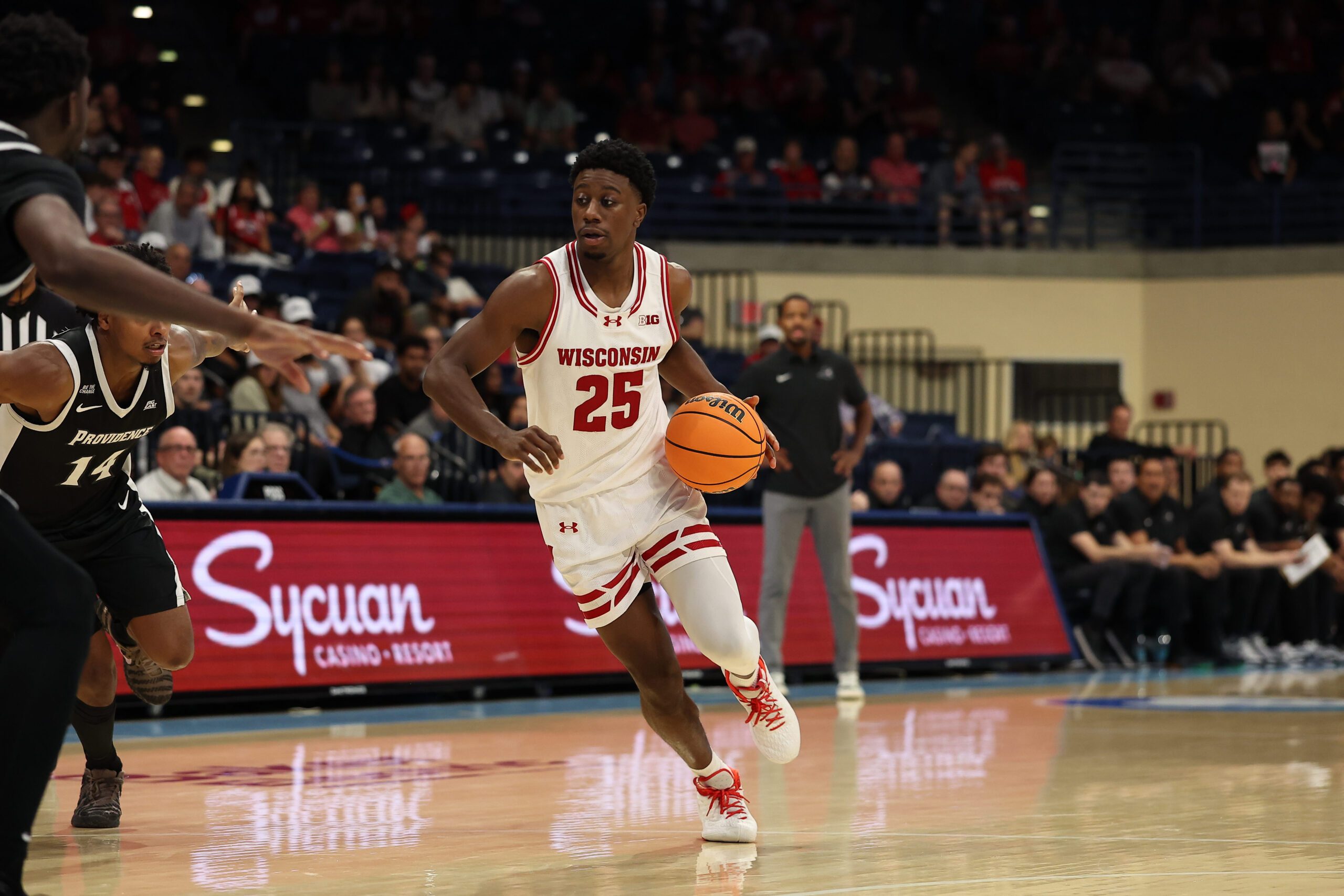 Nov 27, 2025; San Diego, CA, USA; Wisconsin Badgers guard John Blackwell (25) handles the ball against the Providence Friars during the second half at Jenny Craig Pavilion. Mandatory Credit: Abe Arredondo-Imagn Images