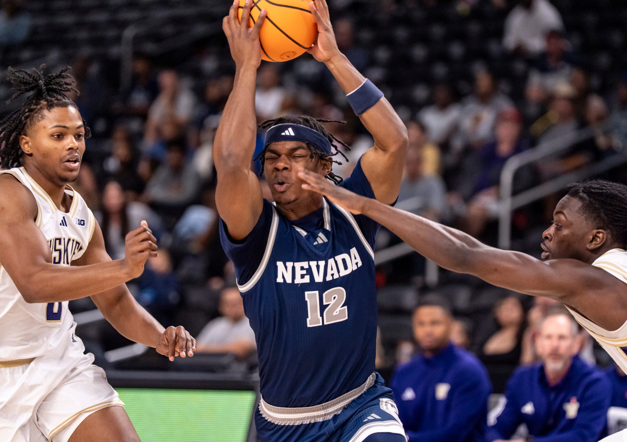 Nevada Wolf Pack guard Tayshawn Comer (12) fights through traffic on the way to the hoop during the first half of their game in the Acrisure Series in Palm Desert, Calif., Thursday, Nov. 27, 2025.