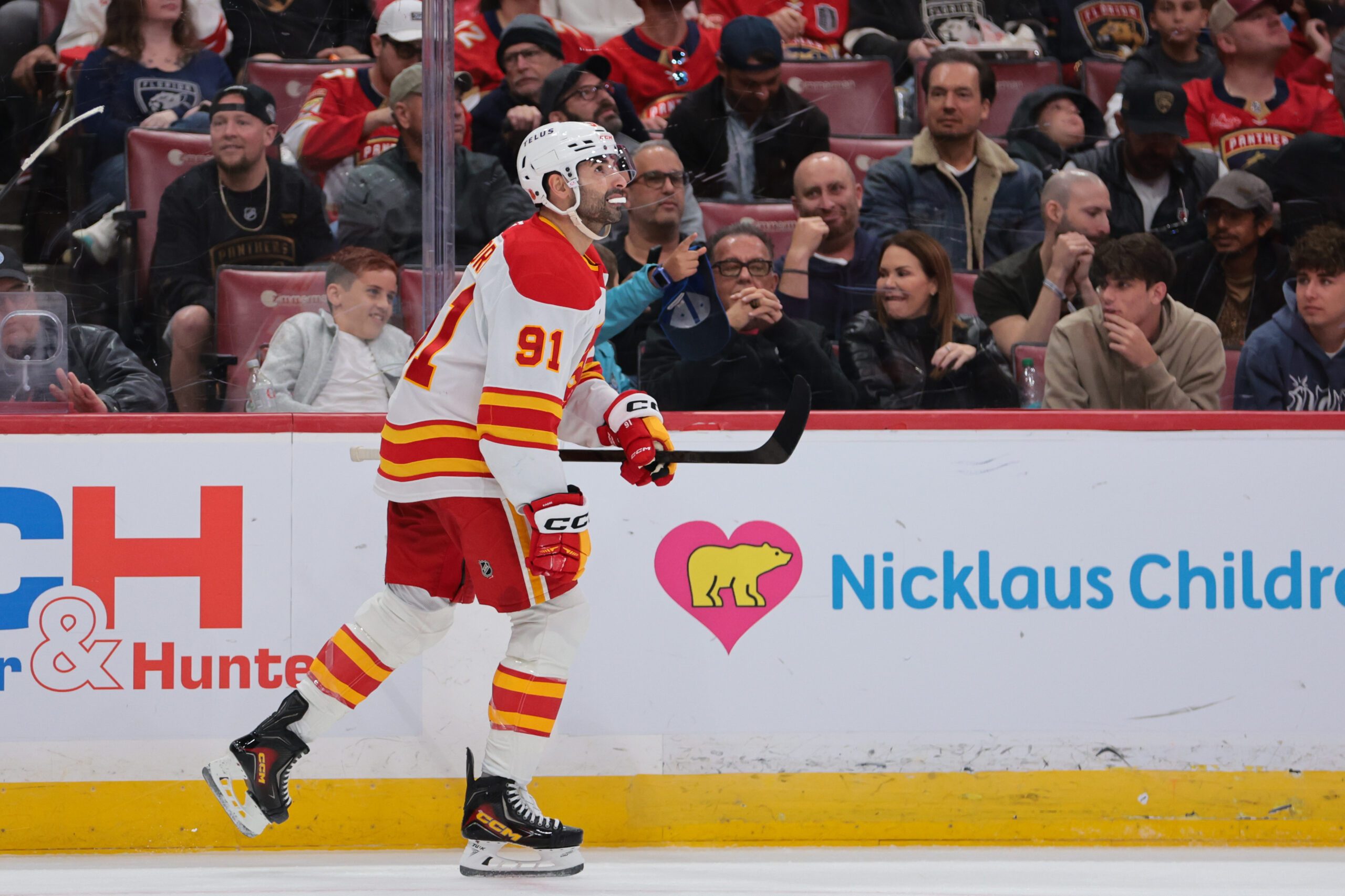 Nov 28, 2025; Sunrise, Florida, USA; Calgary Flames center Nazem Kadri (91) looks on after scoring against the Florida Panthers during the second period at Amerant Bank Arena. Mandatory Credit: Sam Navarro-Imagn Images