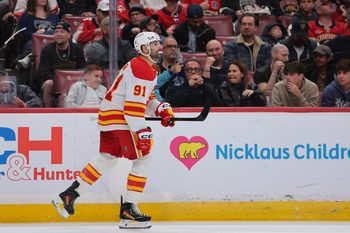Nov 28, 2025; Sunrise, Florida, USA; Calgary Flames center Nazem Kadri (91) looks on after scoring against the Florida Panthers during the second period at Amerant Bank Arena. Mandatory Credit: Sam Navarro-Imagn Images