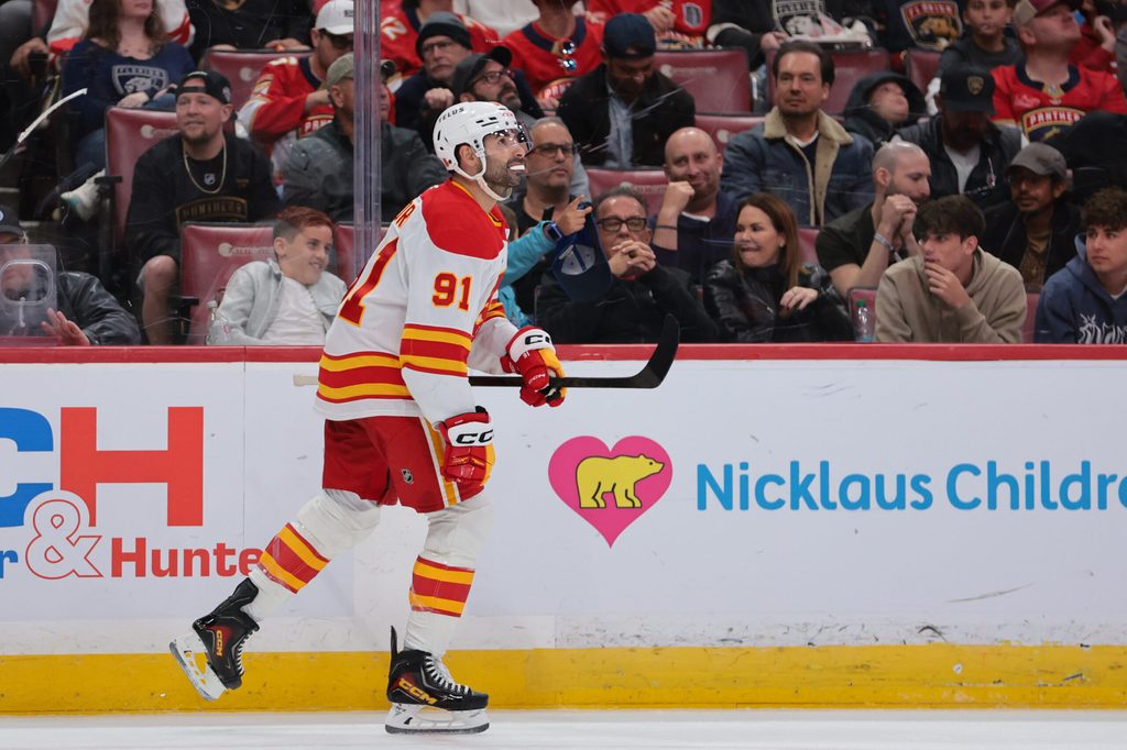 Nov 28, 2025; Sunrise, Florida, USA; Calgary Flames center Nazem Kadri (91) looks on after scoring against the Florida Panthers during the second period at Amerant Bank Arena. Mandatory Credit: Sam Navarro-Imagn Images