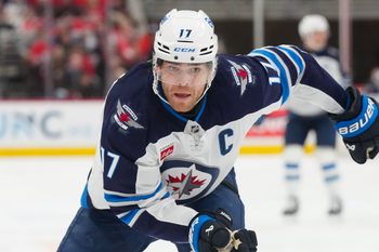 Nov 28, 2025; Raleigh, North Carolina, USA;  Winnipeg Jets center Adam Lowry (17) skates against the Carolina Hurricanes during the second period at Lenovo Center. Mandatory Credit: James Guillory-Imagn Images
