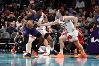 Nov 28, 2025; Charlotte, North Carolina, USA; Charlotte Hornets forward Brandon Miller (24) looks to drive in as he is defended by Chicago Bulls guard Josh Giddey (3) during the second half at the Spectrum Center. Mandatory Credit: Sam Sharpe-Imagn Images
