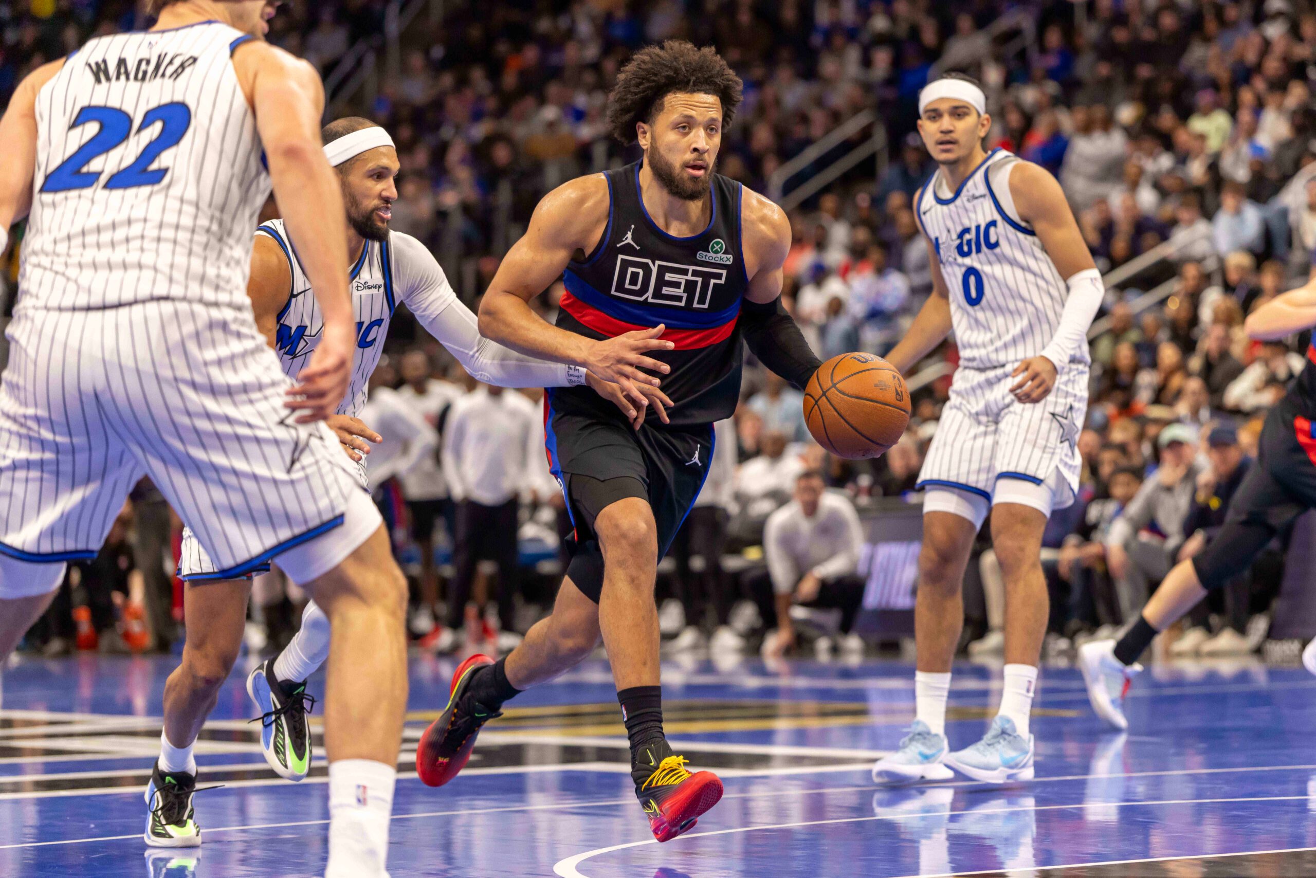 Nov 28, 2025; Detroit, Michigan, USA; Detroit Pistons guard Cade Cunningham (2) moves the ball up court against the Orlando Magic in the second half of the annual in-season NBA Cup tournament at Little Caesars Arena. Mandatory Credit: David Reginek-Imagn Images