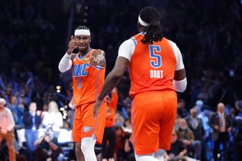 Nov 28, 2025; Oklahoma City, Oklahoma, USA; Oklahoma City Thunder guard Shai Gilgeous-Alexander (2) gestures towards guard Luguentz Dort (5) after a basket against the Phoenix Suns during the second half at Paycom Center. Mandatory Credit: Alonzo Adams-Imagn Images