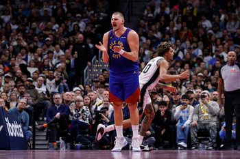 Nov 28, 2025; Denver, Colorado, USA; Denver Nuggets center Nikola Jokic (15) reacts after a play in the fourth quarter against the San Antonio Spurs at Ball Arena. Mandatory Credit: Isaiah J. Downing-Imagn Images