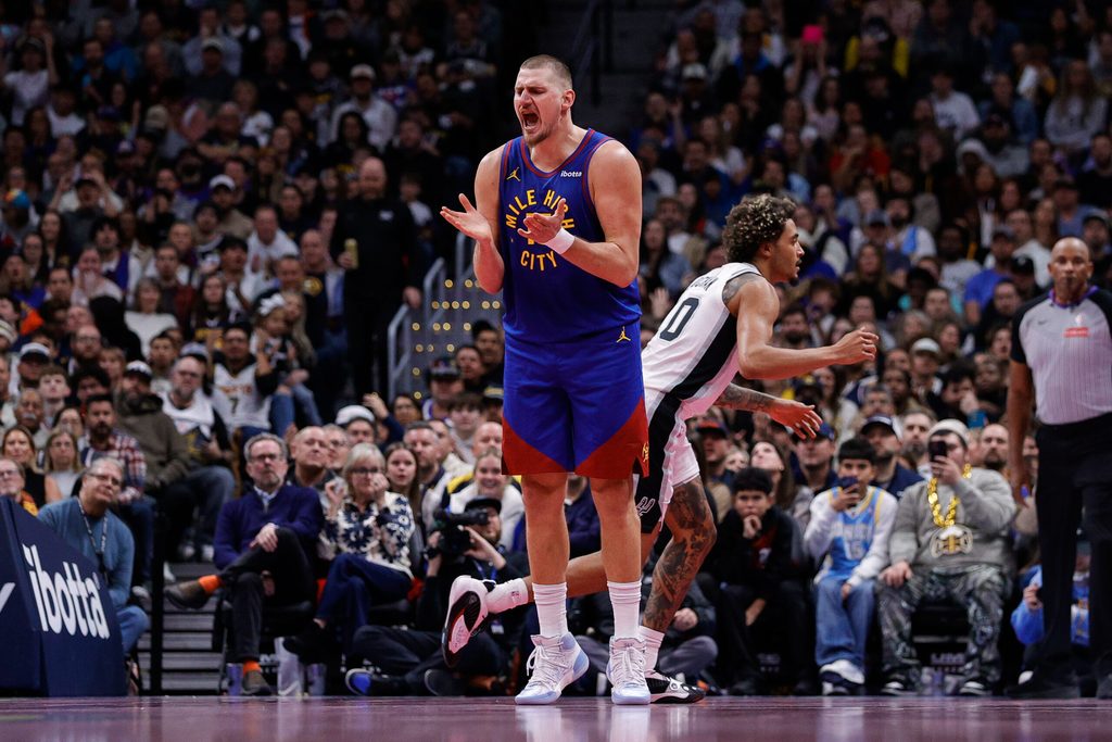 Nov 28, 2025; Denver, Colorado, USA; Denver Nuggets center Nikola Jokic (15) reacts after a play in the fourth quarter against the San Antonio Spurs at Ball Arena. Mandatory Credit: Isaiah J. Downing-Imagn Images