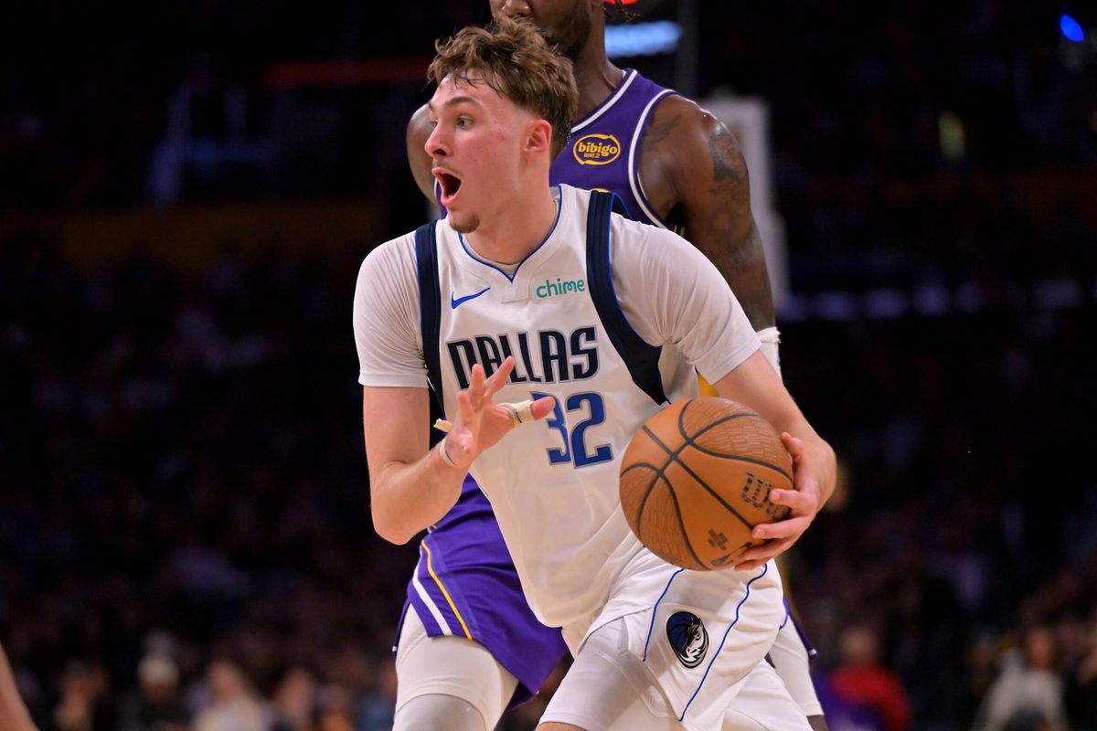 Nov 28, 2025; Los Angeles, California, USA; Dallas Mavericks forward Cooper Flagg (32) drives to the basket in the second half against the Los Angeles Lakers at Crypto.com Arena. Mandatory Credit: Jayne Kamin-Oncea-Imagn Images
