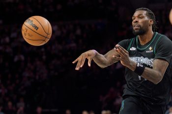 Nov 29, 2025; Minneapolis, Minnesota, USA; Minnesota Timberwolves center Naz Reid (11) passes against the Boston Celtics in the fourth quarter at Target Center. Mandatory Credit: Matt Blewett-Imagn Images