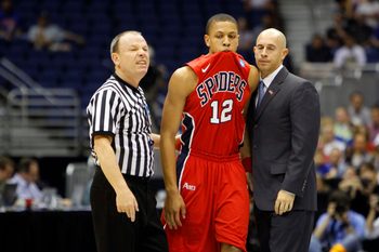 Mar 25, 2011; San Antonio, TX, USA; Richmond Spiders forward Kevin Smith (12) react after talking with a referee during the semifinals of the southwest regional of the 2011 NCAA men's basketball tournament against the Kansas Jayhawks at the Alamodome. Mandatory Credit: Bob Donnan-Imagn Images