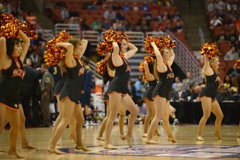 Mar 16, 2013; Anaheim, CA, USA; Pacific Tigers cheerleaders perform during a break in play between the Pacific Tigers and UC Irvine Anteaters in the first half during the championship game of the Big West tournament at the Honda Center. Mandatory Credit: Kelvin Kuo-Imagn Images