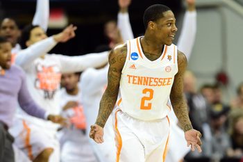 Mar 23, 2014; Raleigh, NC, USA; Tennessee Volunteers guard Antonio Barton (2) reacts to a making a three pinter against the Mercer Bears during the second half of a men's college basketball game during the third round of the 2014 NCAA Tournament at PNC Arena. Mandatory Credit: Bob Donnan-Imagn Images
