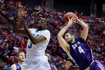Mar 23, 2014; San Diego, CA, USA; UCLA Bruins guard Jordan Adams (3) battles for a rebound with Stephen F. Austin Lumberjacks forward Nikola Gajic (4) in the second half of a men's college basketball game during the third round of the 2014 NCAA Tournament at Viejas Arena. Mandatory Credit: Christopher Hanewinckel-Imagn Images