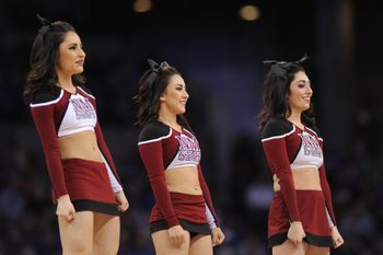 Mar 20, 2015; Omaha, NE, USA; New Mexico State Aggies cheerleaders perform during the first half in the second round of the 2015 NCAA Tournament against the Kansas Jayhawks at CenturyLink Center. Mandatory Credit: Steven Branscombe-Imagn Images