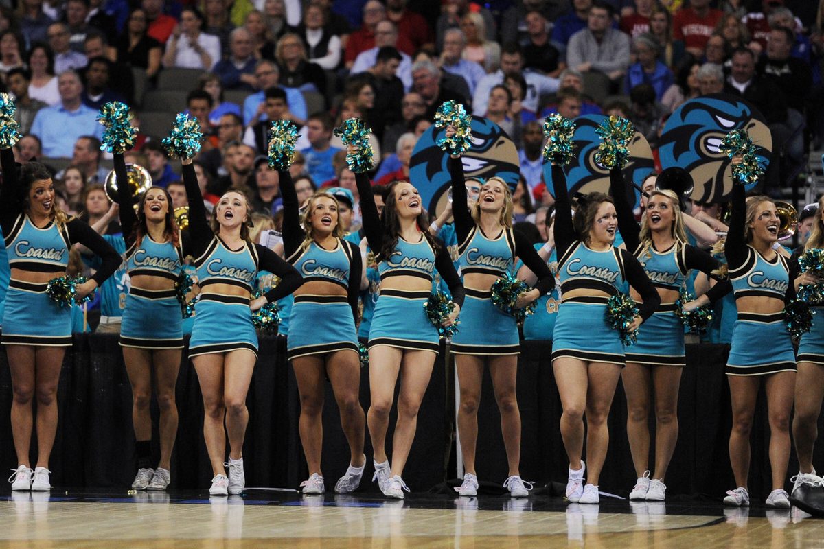 Mar 20, 2015; Omaha, NE, USA; Coastal Carolina Chanticleers cheerleaders perform against the Wisconsin Badgers during the first half in the second round of the 2015 NCAA Tournament at CenturyLink Center. Mandatory Credit: Steven Branscombe-Imagn Images