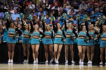Mar 20, 2015; Omaha, NE, USA; Coastal Carolina Chanticleers cheerleaders perform against the Wisconsin Badgers during the first half in the second round of the 2015 NCAA Tournament at CenturyLink Center. Mandatory Credit: Steven Branscombe-Imagn Images