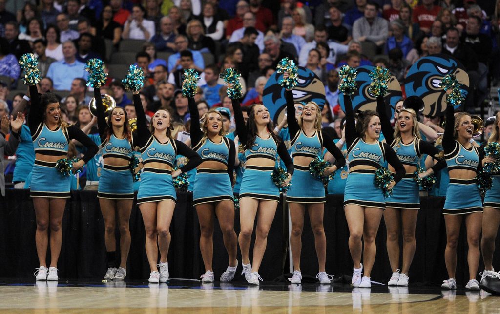 Mar 20, 2015; Omaha, NE, USA; Coastal Carolina Chanticleers cheerleaders perform against the Wisconsin Badgers during the first half in the second round of the 2015 NCAA Tournament at CenturyLink Center. Mandatory Credit: Steven Branscombe-Imagn Images