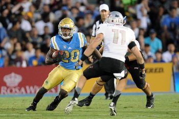September 10, 2016; Pasadena, CA, USA;  UCLA Bruins running back Brandon Stephens (20) runs the ball against the UNLV Rebels during the second half at Rose Bowl. Mandatory Credit: Gary A. Vasquez-Imagn Images