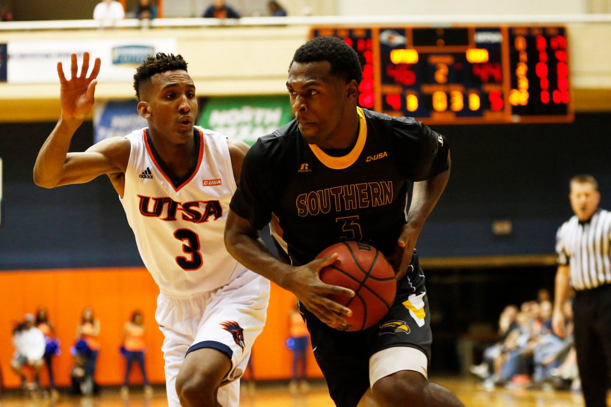Feb 9, 2017; San Antonio, TX, USA; Southern Miss Golden Eagles guard Robert Thomas III (3) drives to the basket while guarded by UTSA Roadrunners guard Gino Littles (3) during the second half at UTSA Convocation Center. Mandatory Credit: Soobum Im-Imagn Images