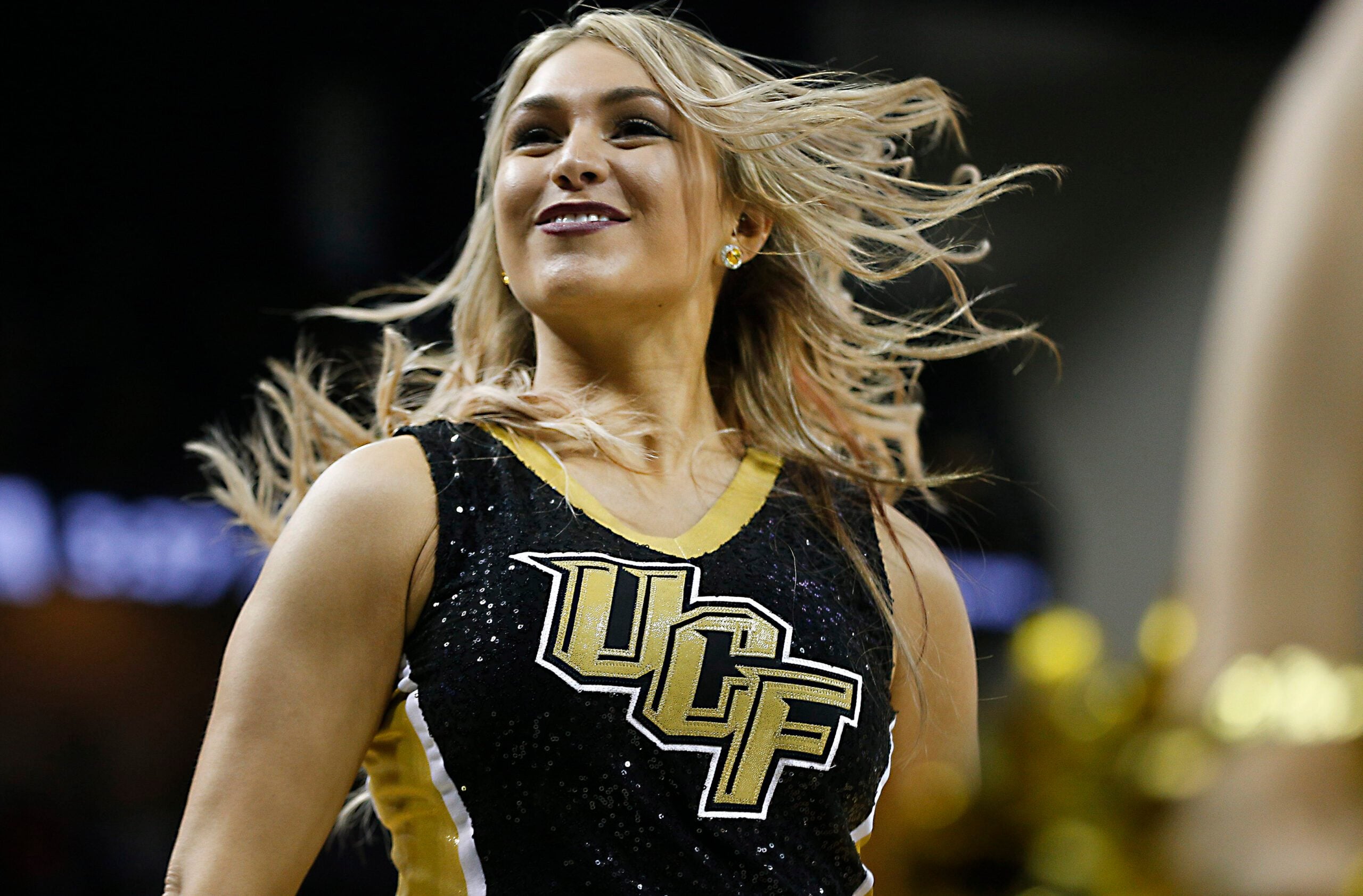 Jan 31, 2018; Orlando, FL, USA; A UCF Knights cheerleader performs during the second half against the Connecticut Huskies at CFE Federal Credit Union Arena. Mandatory Credit: Reinhold Matay-Imagn Images
