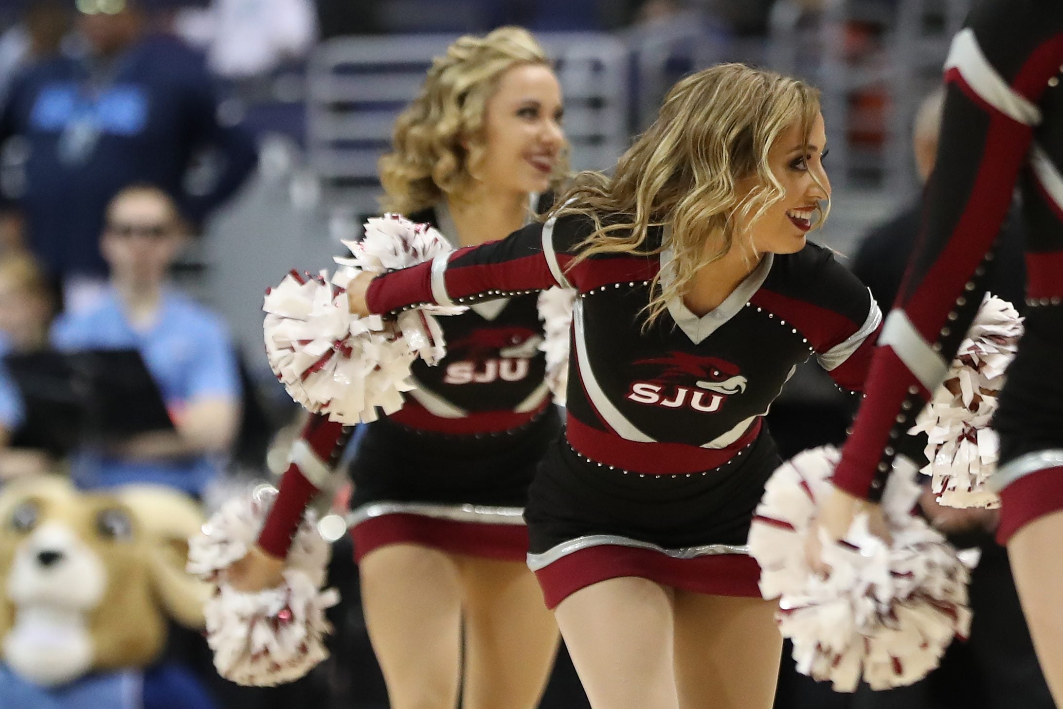 Mar 10, 2018; Washington, DC, USA; Saint Joseph's Hawks cheerleaders dance on the court during a timeout against the Rhode Island Rams in the first half in an Atlantic 10 conference tournament semifinal at Capital One Arena. The Rams won 90-87. Mandatory Credit: Geoff Burke-Imagn Images