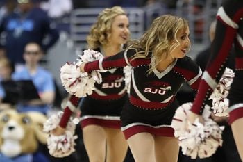 Mar 10, 2018; Washington, DC, USA; Saint Joseph's Hawks cheerleaders dance on the court during a timeout against the Rhode Island Rams in the first half in an Atlantic 10 conference tournament semifinal at Capital One Arena. The Rams won 90-87. Mandatory Credit: Geoff Burke-Imagn Images