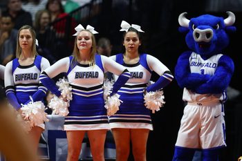 Mar 24, 2019; Tulsa, OK, USA; Buffalo Bulls mascot and cheerleaders watch the Texas Tech Red Raiders cheerleaders preform on the court during a stoppage in play in the first half in the second round of the 2019 NCAA Tournament at BOK Center. Mandatory Credit: Mark J. Rebilas-Imagn Images