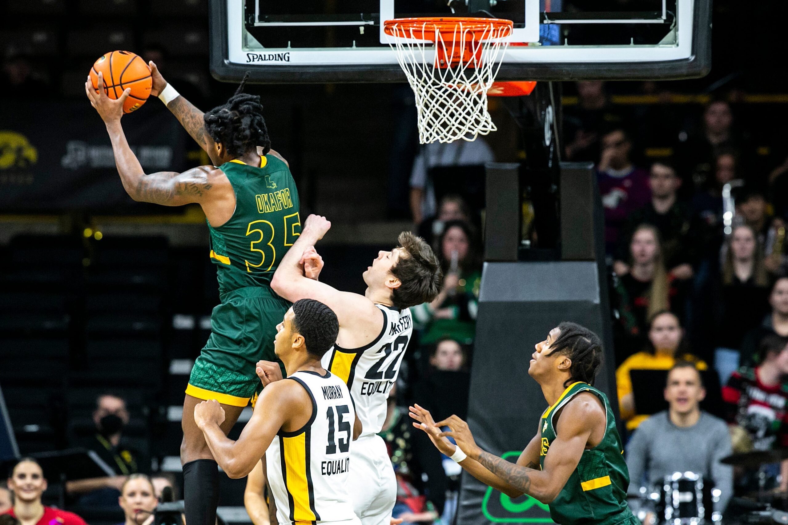 Southeastern Louisiana's Gus Okafor (35) pulls down a rebound against Iowa forwards Keegan Murray (15) and Patrick McCaffery (22) during a NCAA non-conference men's basketball game, Tuesday, Dec. 21, 2021, at Carver-Hawkeye Arena in Iowa City, Iowa.

211221 Se Louisiana Iowa Mbb 016 Jpg