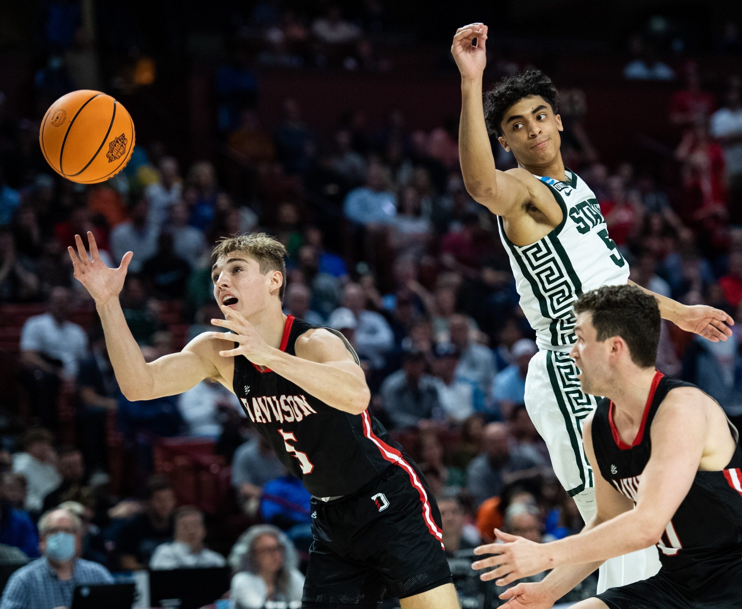 Davidson College guard Grant Huffman (5) attempts to gain possession of the ball against Michigan State University  during the NCAA Men's Division I Basketball Tournament at the Bon Secours Wellness Arena Friday, March 18, 2022.

Jm Michigan 031822 008