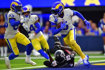 Sep 18, 2022; Inglewood, California, USA; Los Angeles Rams cornerback Jalen Ramsey (5) runs the ball after intercepting a pass intended for Atlanta Falcons wide receiver Bryan Edwards (89) during the second half at SoFi Stadium. Mandatory Credit: Gary A. Vasquez-Imagn Images