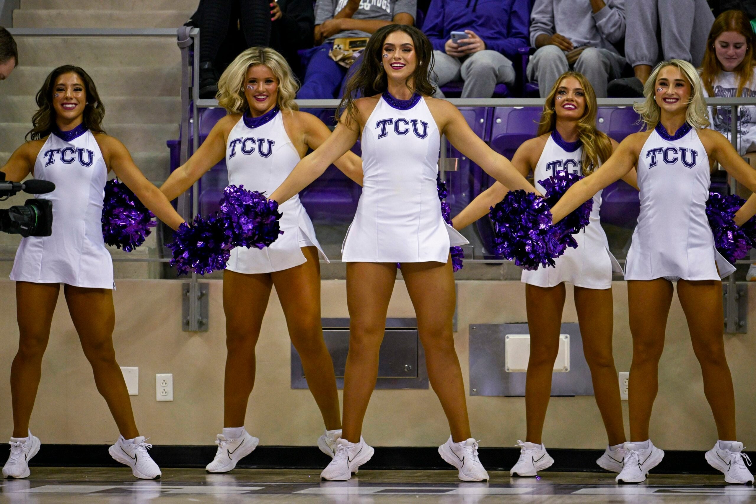 Nov 7, 2022; Fort Worth, Texas, USA; The TCU Horned Frogs showgirls cheerleader dancers perform during the game between the TCU Horned Frogs and the Arkansas-Pine Bluff Golden Lions at Ed and Rae Schollmaier Arena. Mandatory Credit: Jerome Miron-Imagn Images