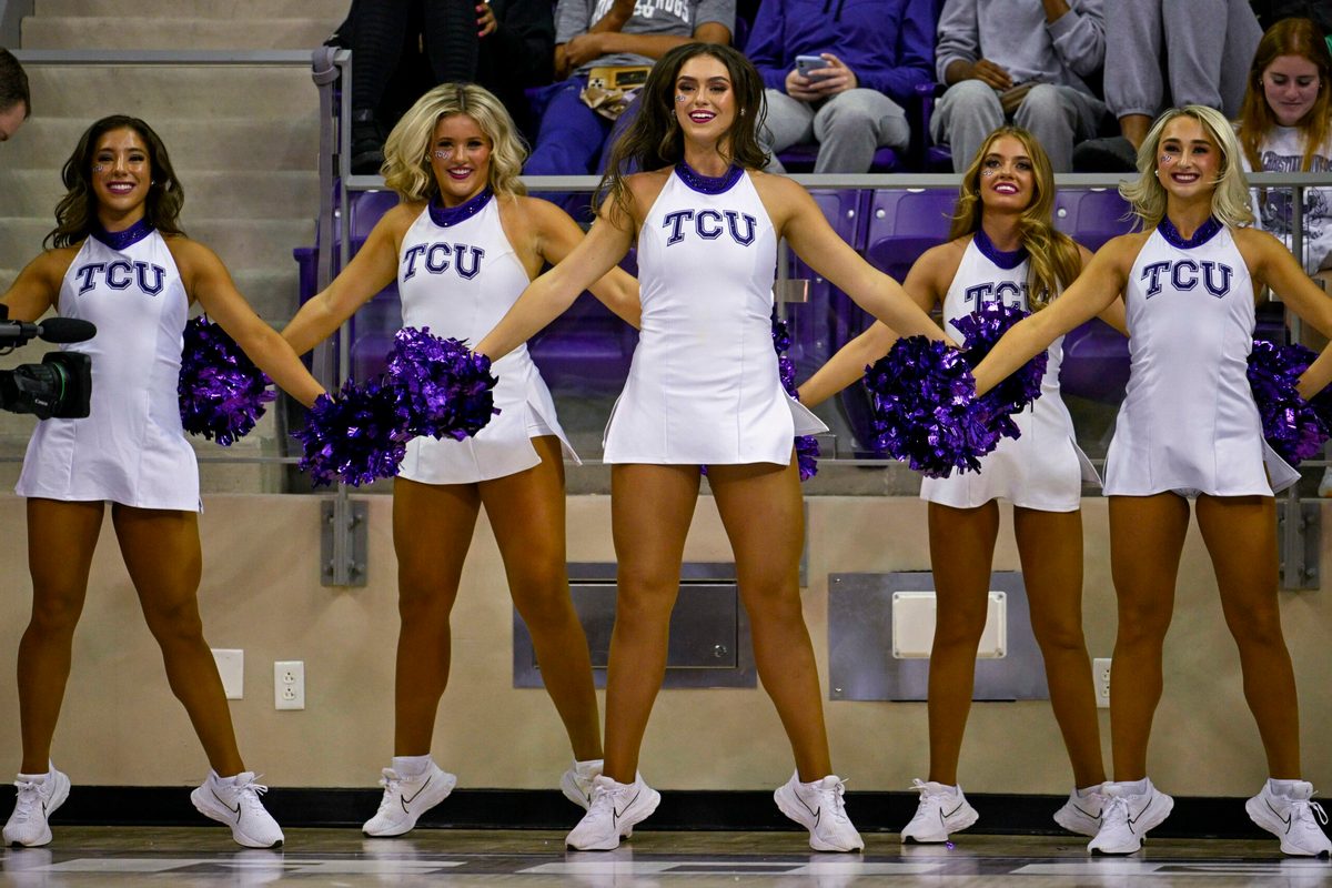 Nov 7, 2022; Fort Worth, Texas, USA; The TCU Horned Frogs showgirls cheerleader dancers perform during the game between the TCU Horned Frogs and the Arkansas-Pine Bluff Golden Lions at Ed and Rae Schollmaier Arena. Mandatory Credit: Jerome Miron-Imagn Images
