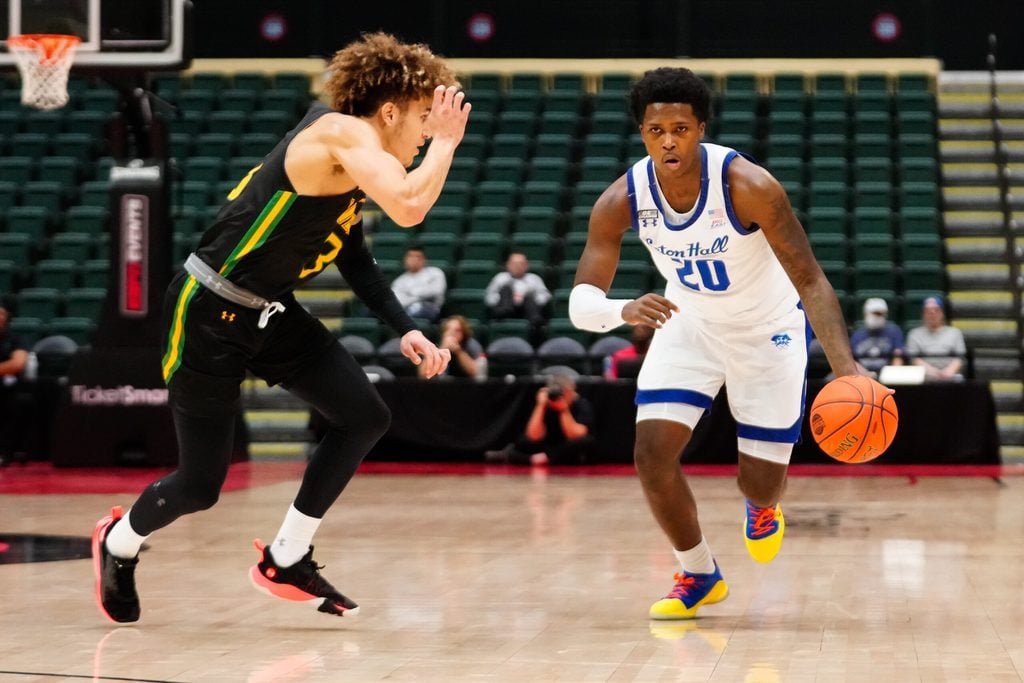 Nov 27, 2022; Orlando, FL, USA; Seton Hall Pirates guard Jaquan Sanders (20) drives the ball up the court against Siena Saints guard Michael Eley (3) during the first half at ESPN Wide World of Sports. Mandatory Credit: Rich Storry-Imagn Images