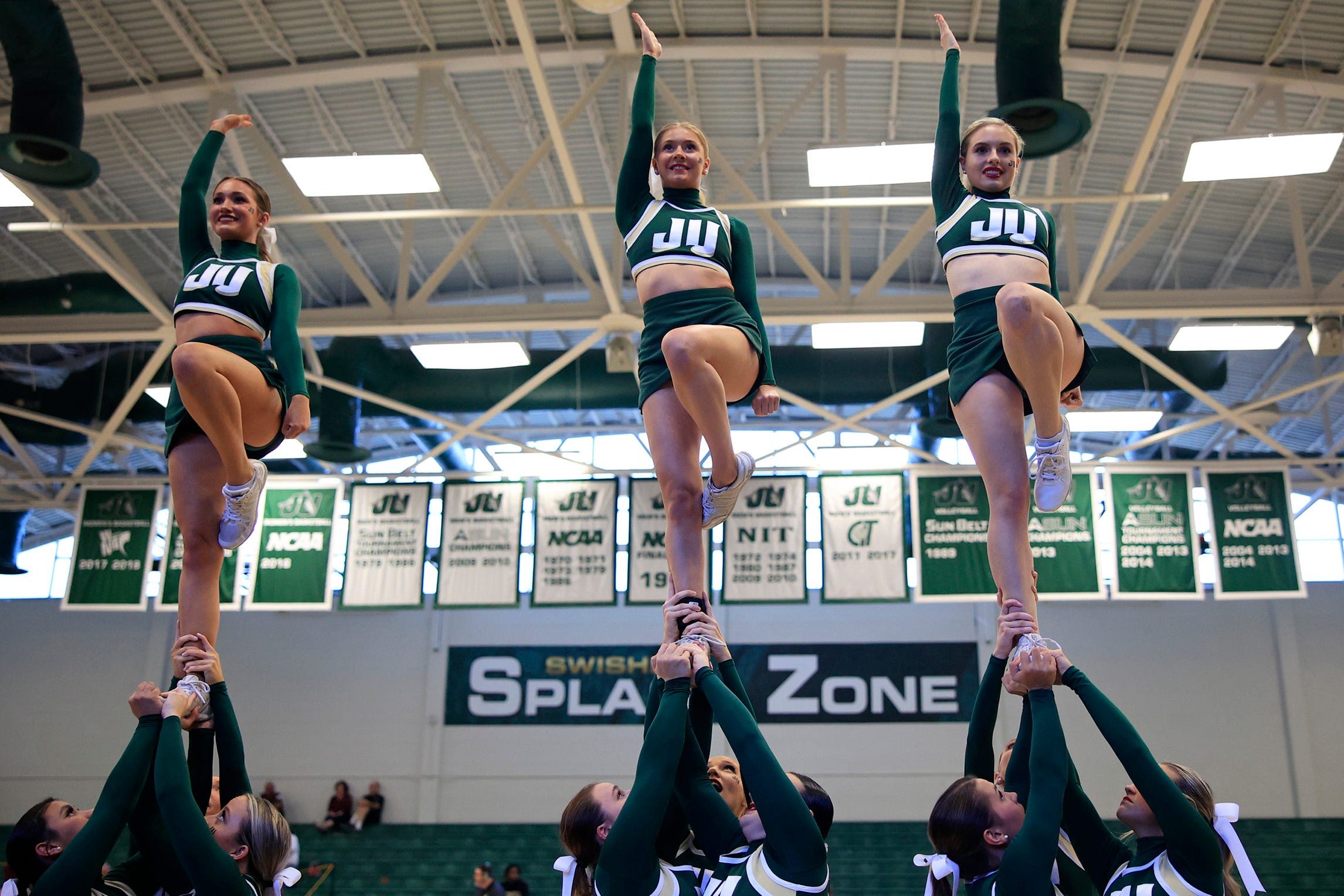 The Jacksonville Dolphins cheerleaders warm up before an ASUN Conference mens basketball matchup Wednesday, Feb. 22, 2023 at Jacksonville University's Swisher Gymnasium in Jacksonville, Fla. The Bellarmine Knights defeated the Jacksonville Dolphins 63-61.

Jki 022223 Ju Bellarmine Basketball 08