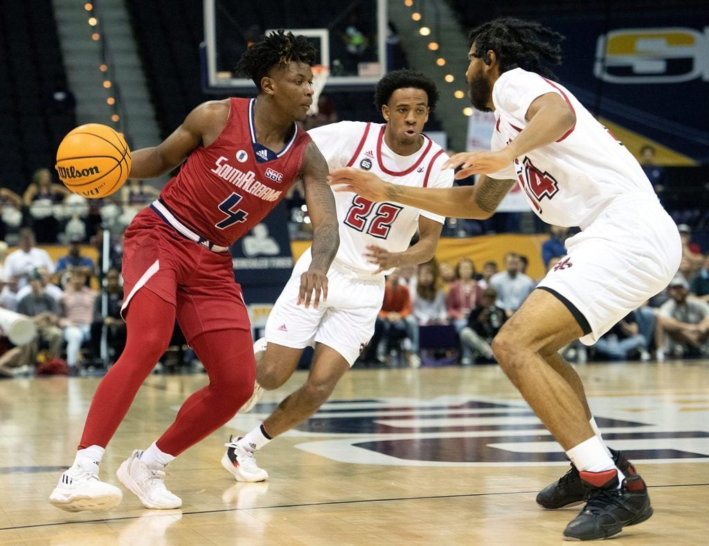 South Alabama's Isaiah Moore (No. 4) splits Louisiana's defense during the SBC Men's Basketball Championship game at the Pensacola Bay Center on Monday, March 6, 2023. The Ragin' Cajuns defeat the Jags 71-66.
Sbc Men S Basketball Usa Vs Louisiana