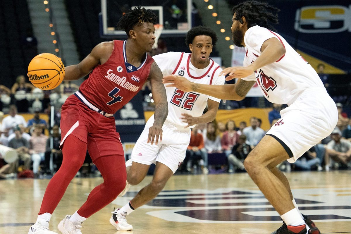 South Alabama's Isaiah Moore (No. 4) splits Louisiana's defense during the SBC Men's Basketball Championship game at the Pensacola Bay Center on Monday, March 6, 2023. The Ragin' Cajuns defeat the Jags 71-66.
Sbc Men S Basketball Usa Vs Louisiana