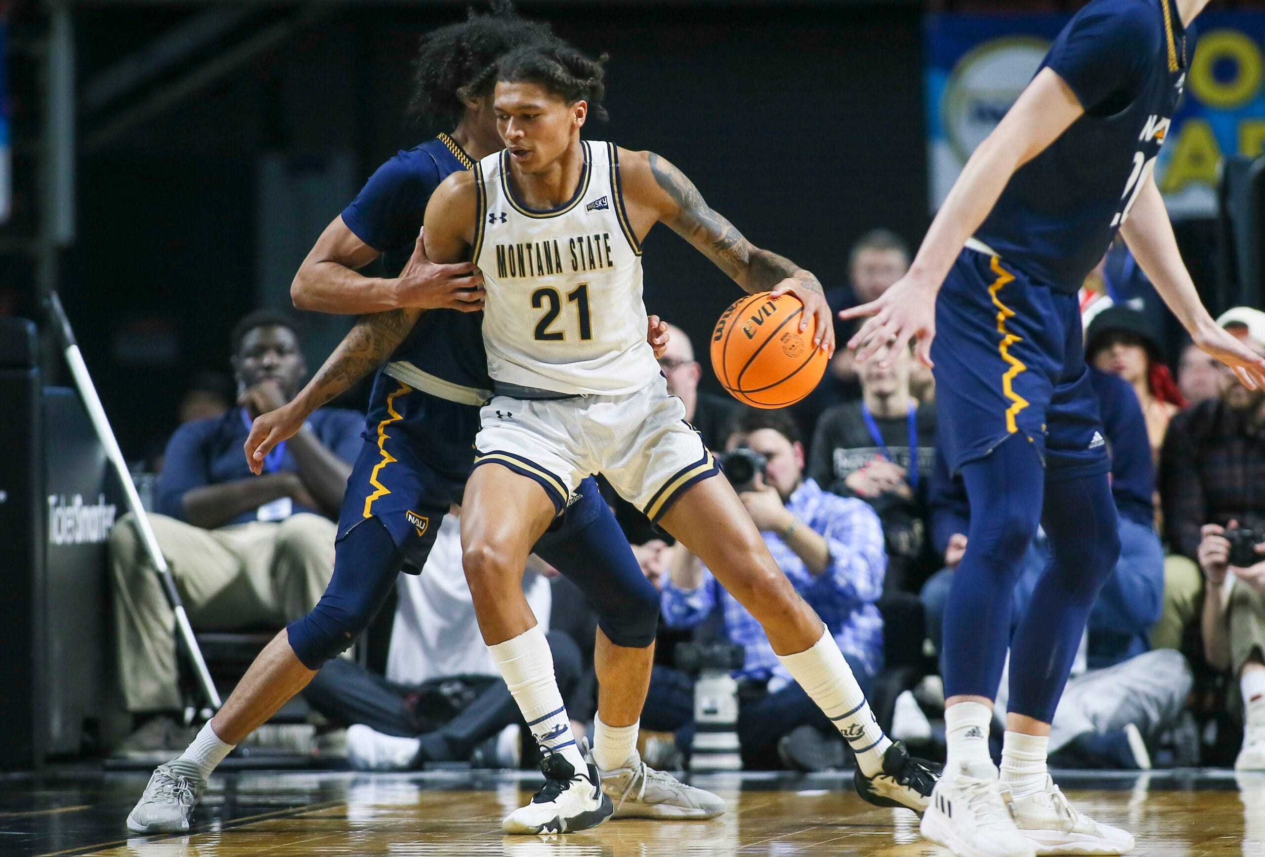 Mar 8, 2023; Boise, ID, USA; Montana State Bobcats guard RaeQuan Battle (21) dribbles during the second half against Northern Arizona Lumberjacks at Idaho Central Arena. Montana State defeated Northern Arizona 85-78. Mandatory Credit: Brian Losness-Imagn Images