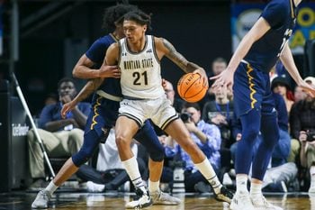 Mar 8, 2023; Boise, ID, USA; Montana State Bobcats guard RaeQuan Battle (21) dribbles during the second half against Northern Arizona Lumberjacks at Idaho Central Arena. Montana State defeated Northern Arizona 85-78. Mandatory Credit: Brian Losness-Imagn Images