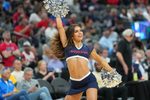 Mar 10, 2023; Las Vegas, NV, USA; An Arizona Wildcats cheerleader performs at a game between the Wildcats and the Arizona State Sun Devils during the first half at T-Mobile Arena. Mandatory Credit: Stephen R. Sylvanie-Imagn Images