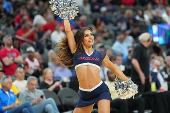Mar 10, 2023; Las Vegas, NV, USA; An Arizona Wildcats cheerleader performs at a game between the Wildcats and the Arizona State Sun Devils during the first half at T-Mobile Arena. Mandatory Credit: Stephen R. Sylvanie-Imagn Images