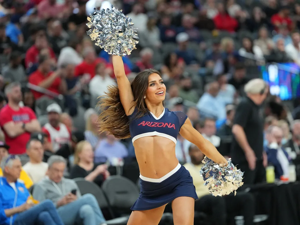 Mar 10, 2023; Las Vegas, NV, USA; An Arizona Wildcats cheerleader performs at a game between the Wildcats and the Arizona State Sun Devils during the first half at T-Mobile Arena. Mandatory Credit: Stephen R. Sylvanie-Imagn Images