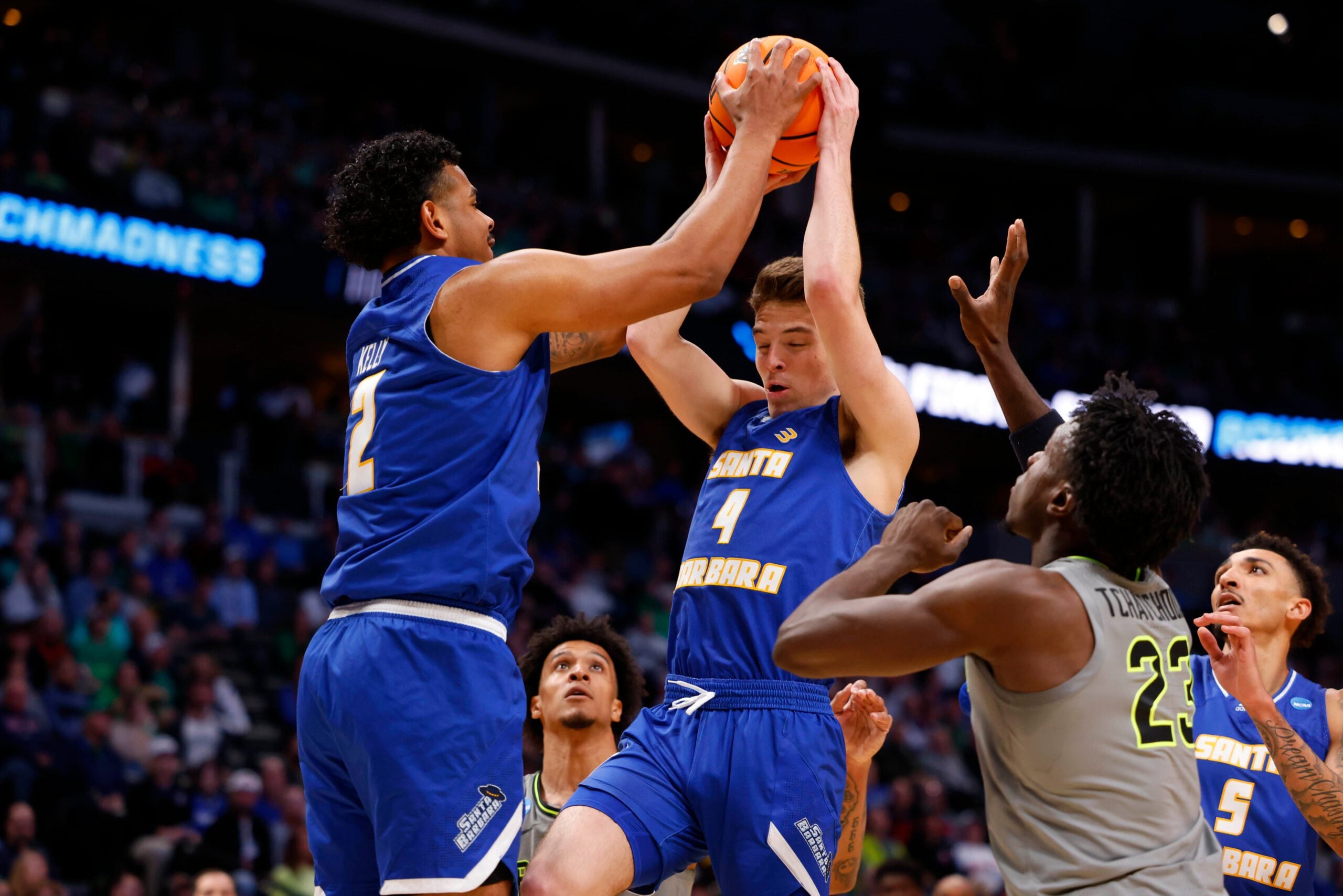 Mar 17, 2023; Denver, CO, USA;  UC Santa Barbara Gauchos guard Cole Anderson (4) handles the ball against Baylor Bears forward Jonathan Tchamwa Tchatchoua (23) during the second half in the first round of the 2023 NCAA men   s basketball tournament at Ball Arena. Mandatory Credit: Michael Ciaglo-Imagn Images