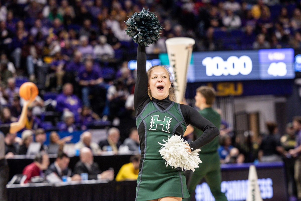 Mar 17, 2023; Baton Rouge, LA, USA; Hawai'i Rainbow Wahine cheerleaders perform against the LSU Lady Tigers during the second half at Pete Maravich Assembly Center. Mandatory Credit: Stephen Lew-Imagn Images