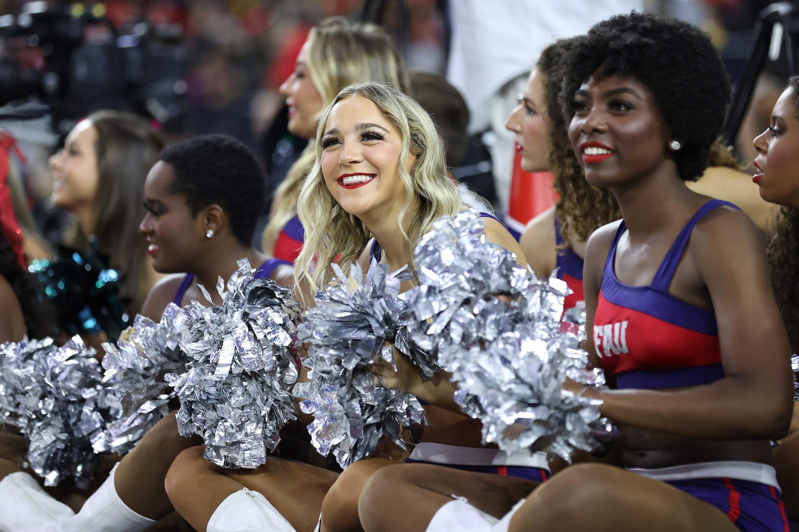 Mar 31, 2023; Houston, TX, USA; Florida Atlantic Owls cheerleaders look on from the court during a practice session the day before the Final Four of the 2023 NCAA Tournament at NRG Stadium. Mandatory Credit: Troy Taormina-Imagn Images