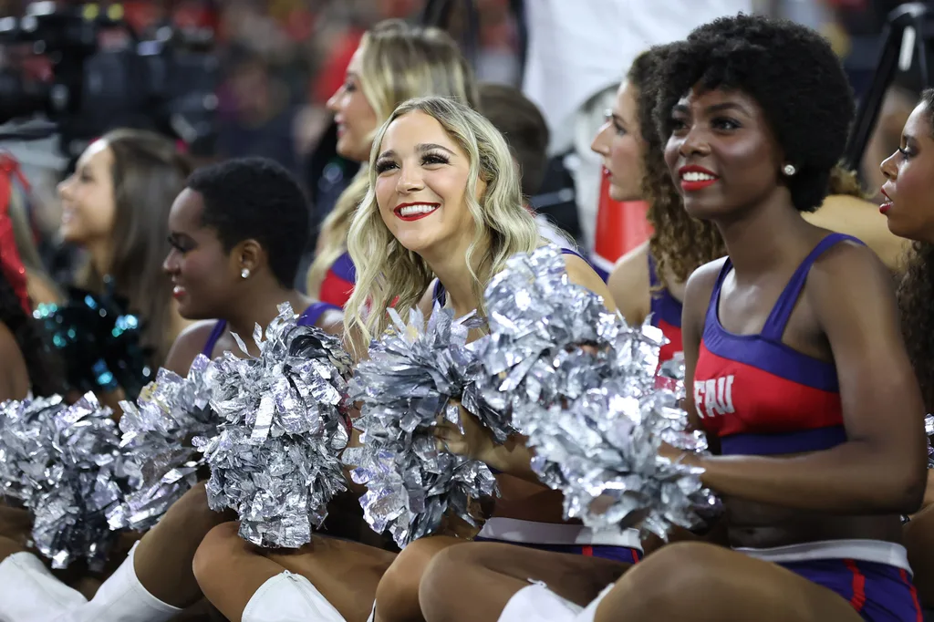Mar 31, 2023; Houston, TX, USA; Florida Atlantic Owls cheerleaders look on from the court during a practice session the day before the Final Four of the 2023 NCAA Tournament at NRG Stadium. Mandatory Credit: Troy Taormina-Imagn Images