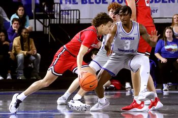 Belmont guard Keishawn Davidson (3) moves the ball around the court as Middle Tennessee guard Jestin Porter (3) guards him during the men   s basketball game on Saturday, Dec. 9, 2023, at MTSU..