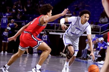 Middle Tennessee guard Jalen Jordan (14) takes the ball down the court as Belmont guard Ja'Kobi Gillespie (0) guards him during the men   s basketball game on Saturday, Dec. 9, 2023, at MTSU..