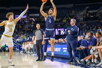 Dec 19, 2023; South Bend, Indiana, USA; Citadel Bulldogs guard Elijah Morgan (4) shoots a three point basket over Notre Dame Fighting Irish guard Braeden Shrewsberry (11) in the second half at the Purcell Pavilion. Mandatory Credit: Matt Cashore-Imagn Images