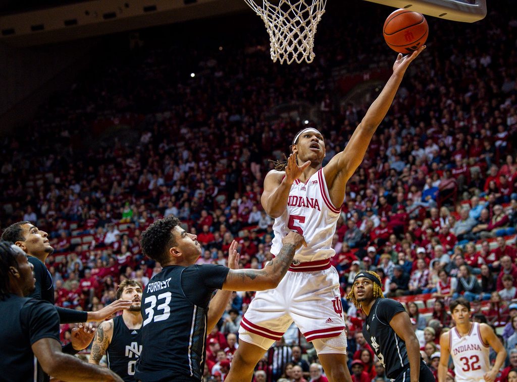 Indiana's Malik Reneau (5) shoots past North Alabama's Damian Forrest (33) during the first half of the Indiana versus North Alabama men's basketball game at Simon Skjodt Assembly Hall on Thursday, December 21, 2023.