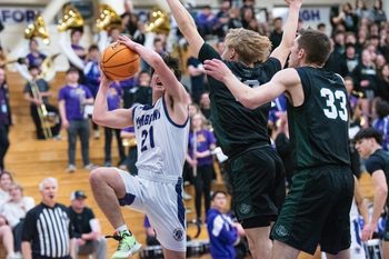 Fort Collins boys basketball's Madden McCollum (21) rises for a shot during a city rivalry boys-girls doubleheader against Fossil Ridge on Tuesday, January 30, 2024, at Fort Collins High School in Fort Collins, Colo.